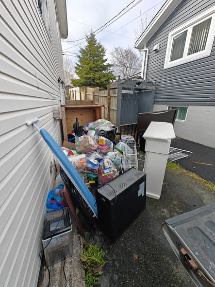 Before: Junk piled up in a residential alley in St. John's NL